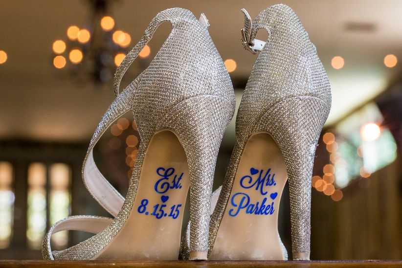 wedding shoes with blue lettering on soles