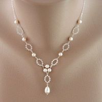 what kind of jewelry would go best?? (pic of dress)