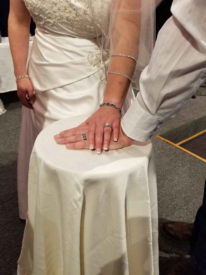Another picture of hands with our rings from our wedding day!!