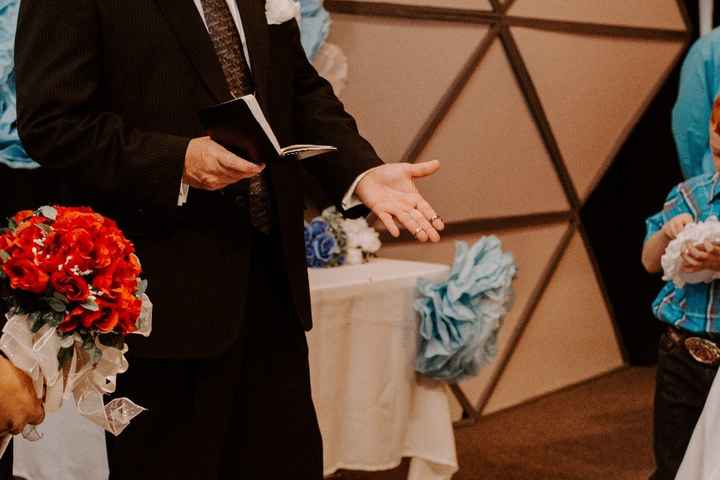 Pastor Rob holding the rings before we exchange them!