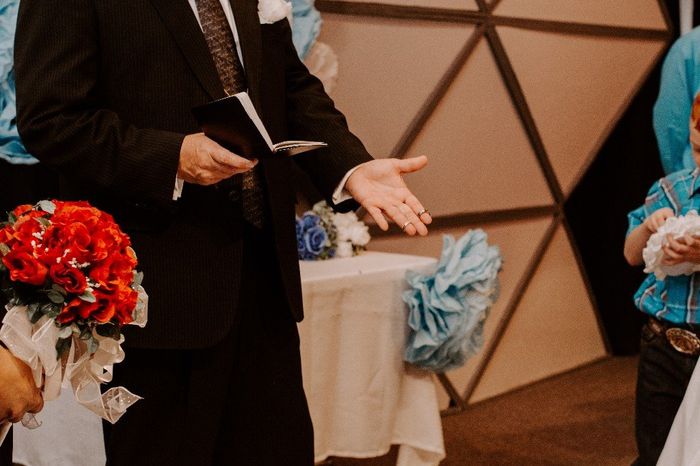 Pastor Rob holding the rings before we exchange them!