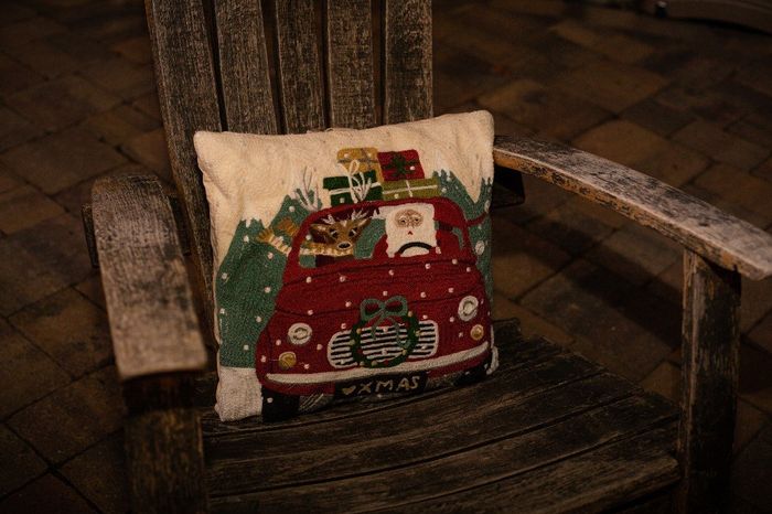 Christmas pillows around the firepit