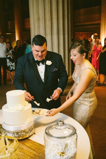 cake cutting in reception dress