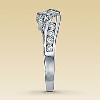 23 small diamonds, and one bigger diamond... I LOVE IT. Lets see some rings my fellow brides.