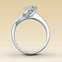 23 small diamonds, and one bigger diamond... I LOVE IT. Lets see some rings my fellow brides.