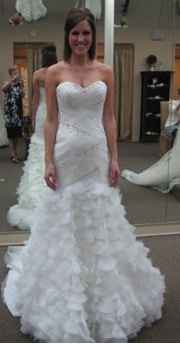 How do you fluff the details on the bottom of a new wedding dress?