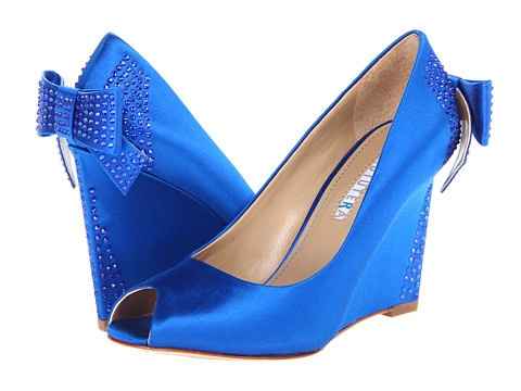 Who is wearing wedges?