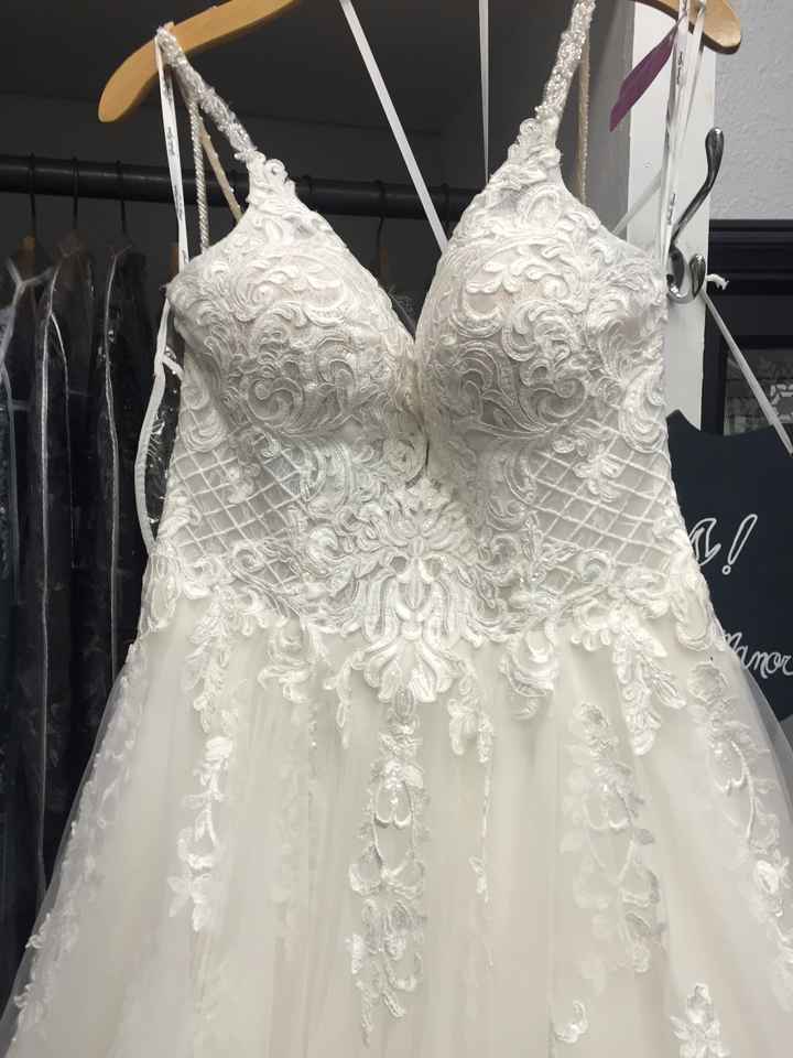 Adding bling to wedding dress shop