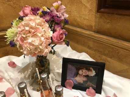 Flowers and pictures on favor table