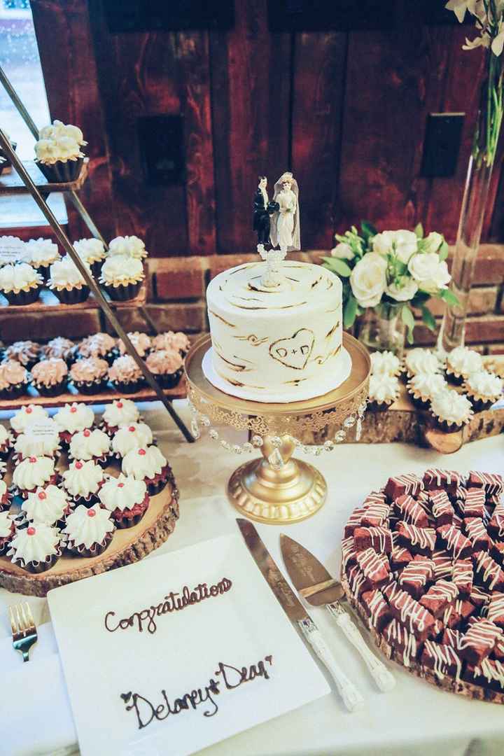 You can see one of the smaller arrangements here behind the cake.
