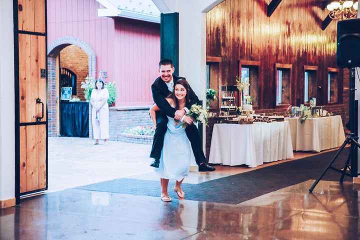 she carried him in, and he threw her bouquet to the bridesmaid that came in before her