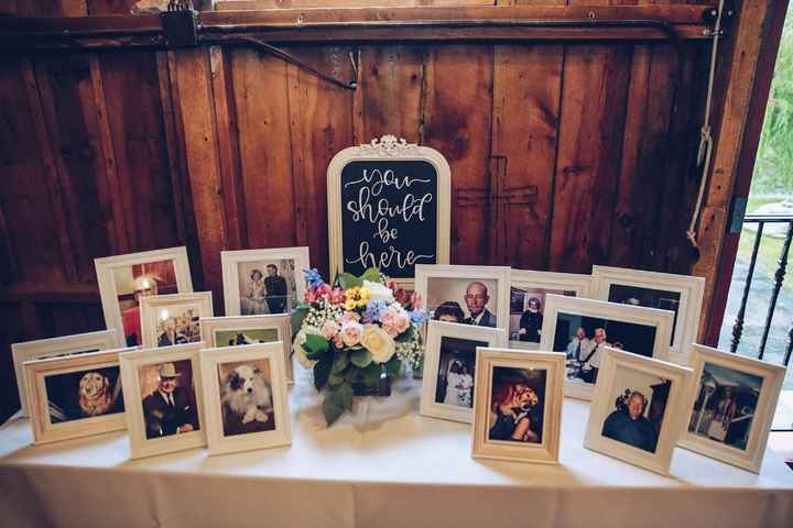 It's very common to have memorial tables at weddings. This is a picture of ours.