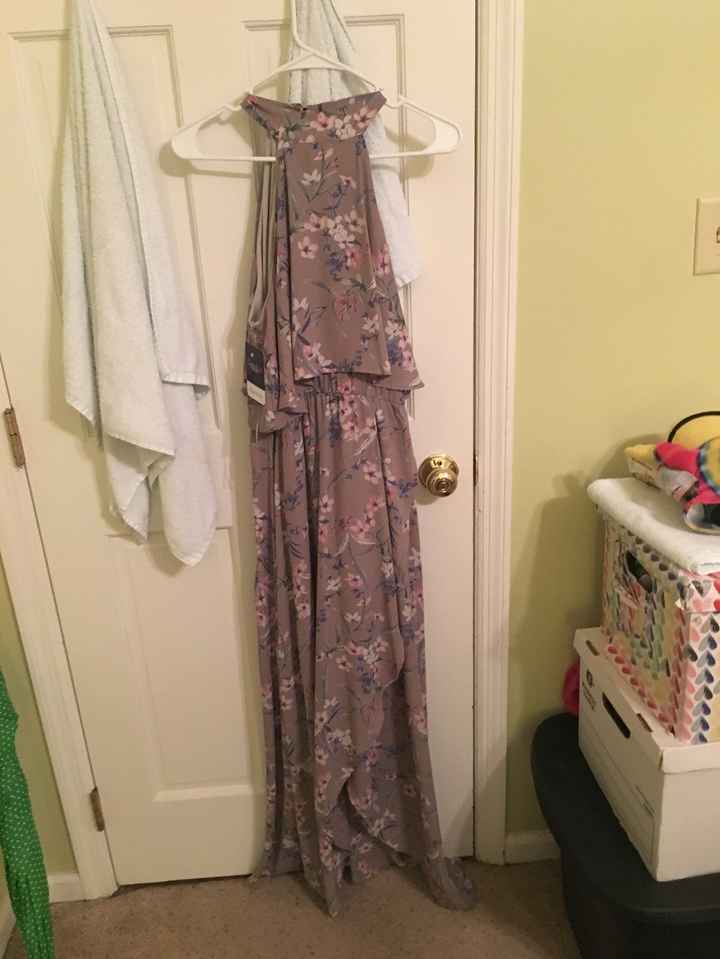 THis is a gray dress with some pink, white and blue accents in it