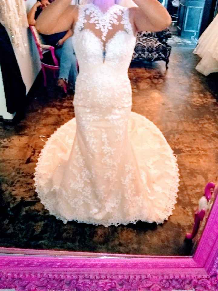 Who is your wedding dress designer? - 1