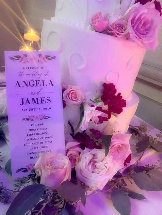 Cake and wedding program with flowers