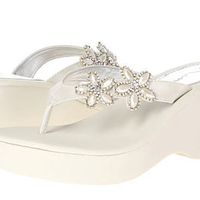 Who is wearing wedges?