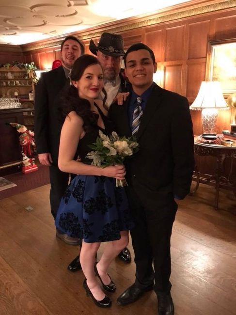 My daughter and her boyfriend being photobombed by my stepson and hubby.