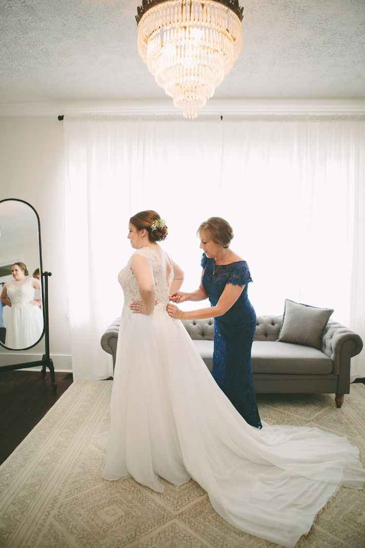 Putting on the gown with my Mom