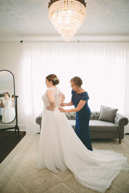 Putting on the gown with my Mom