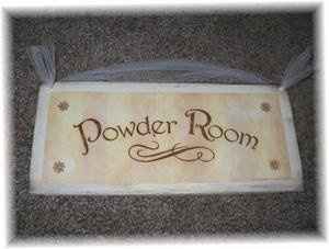 Bought powder room signs to cover venue uglies
