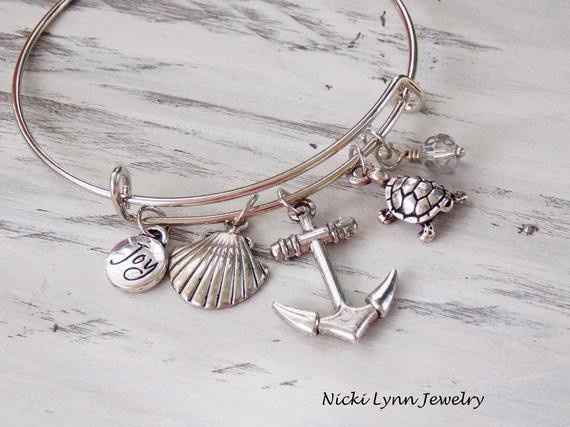 https://www.etsy.com/listing/666200796/oceans-charm-adjustable-bracelet-charm?ga_order=most_relevant