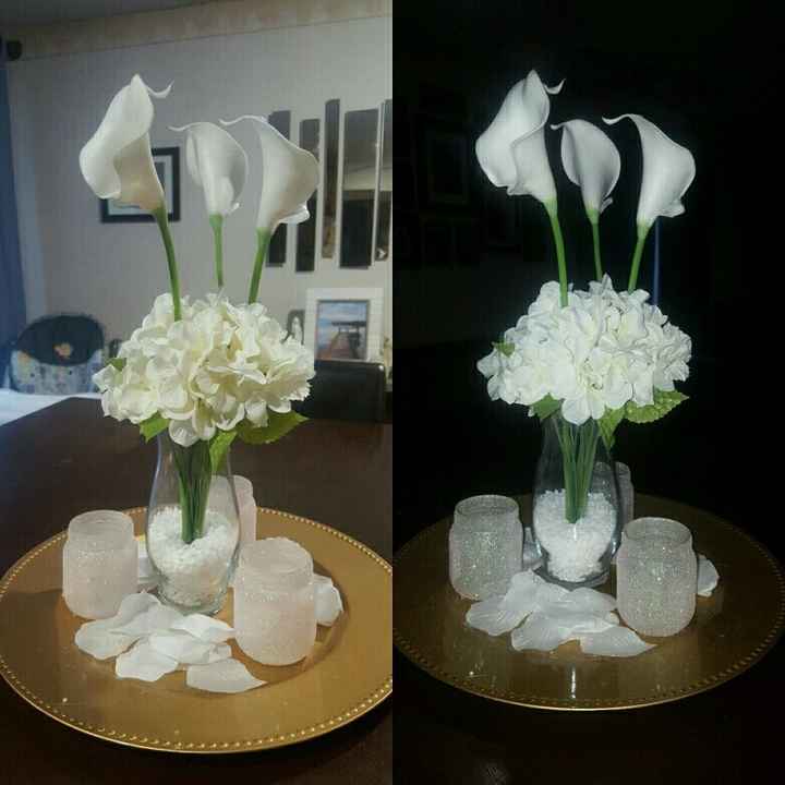 My center pieces..silk flowers. Bout 5$ each table.