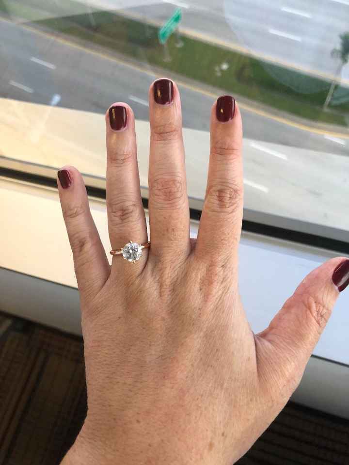 Round cut with rose gold band 