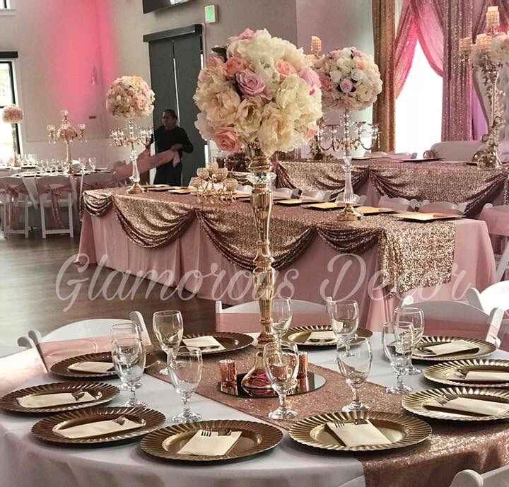my wedding is similar to this but pink table cloths with the gold sequin runners :)