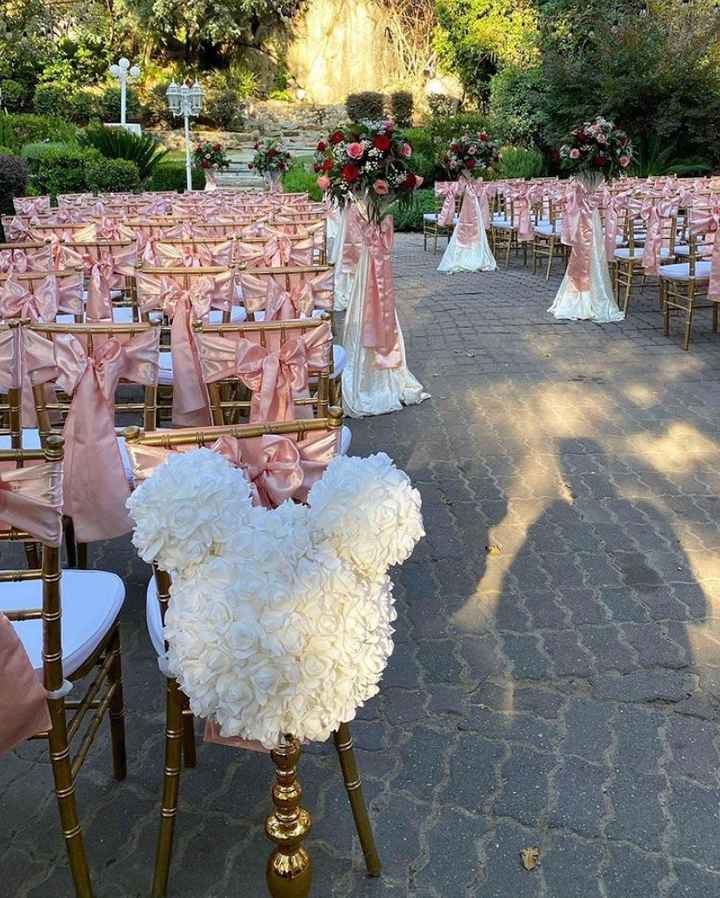 one of the 2 white mickey shaped foam flowers at the end of the aisle :)