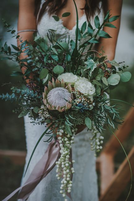 Flowers will be something like this. Unusual central flowers with eucalyptus. Maybe more colorful. N