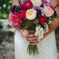 I love this bouquet with pretty reds and cream colors