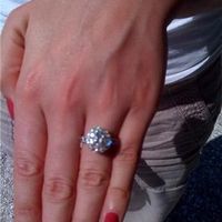 23 small diamonds, and one bigger diamond... I LOVE IT. Lets see some rings my fellow brides.