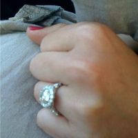 23 small diamonds, and one bigger diamond... I LOVE IT. Lets see some rings my fellow brides.