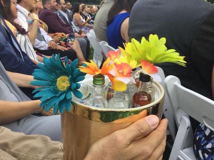 Instead of a typical flower girl, we had a 40yo friend hand out buckets with airline bottles of booz
