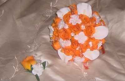 what flowers for black bridesmaids dresses with orange shawls?