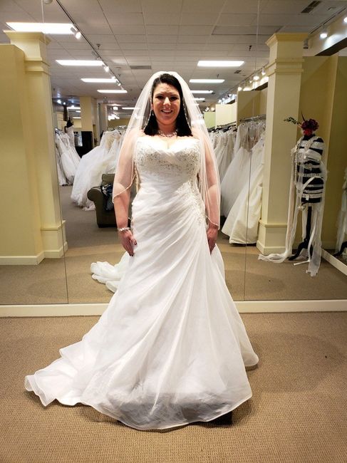 Who is your wedding dress designer? 3