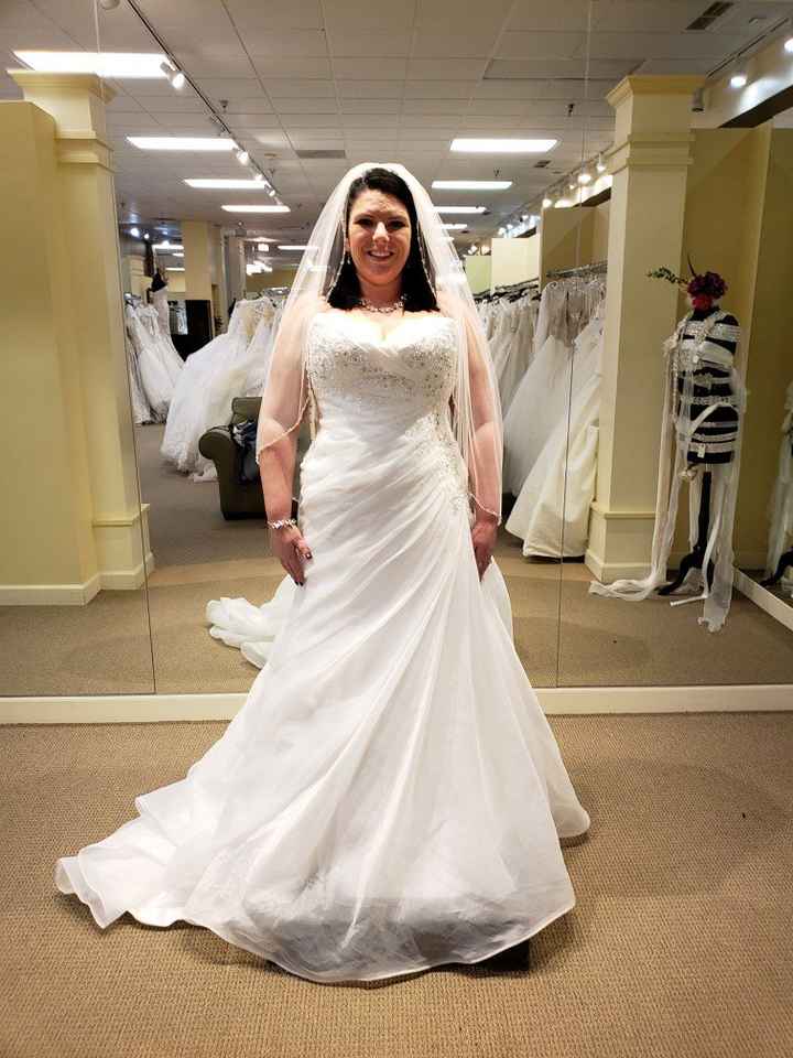 Who is your wedding dress designer? - 1