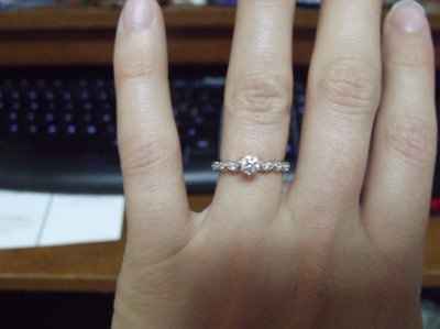 23 small diamonds, and one bigger diamond... I LOVE IT. Lets see some rings my fellow brides.