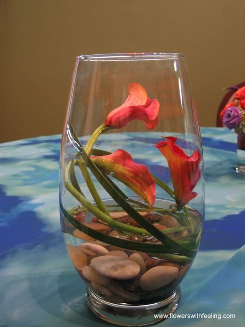 Ideas for centrepieces in hurricane vases? Non-floral? Aqua & white garden party!