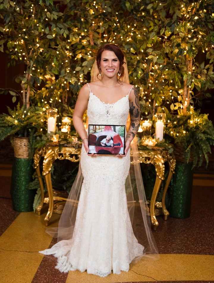 A picture of me holding the picture of my dad my mom and I choose to put on a seat for him. He was a