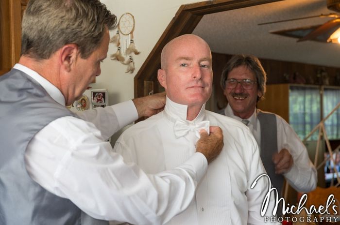 my handsome husband getting ready, BM, his brother, is the background