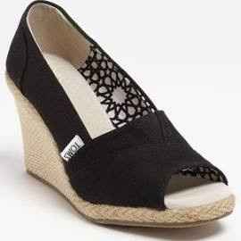 Who is wearing wedges?