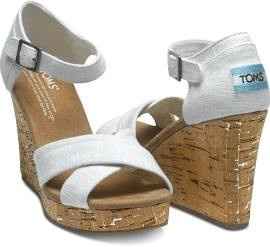 Who is wearing wedges?