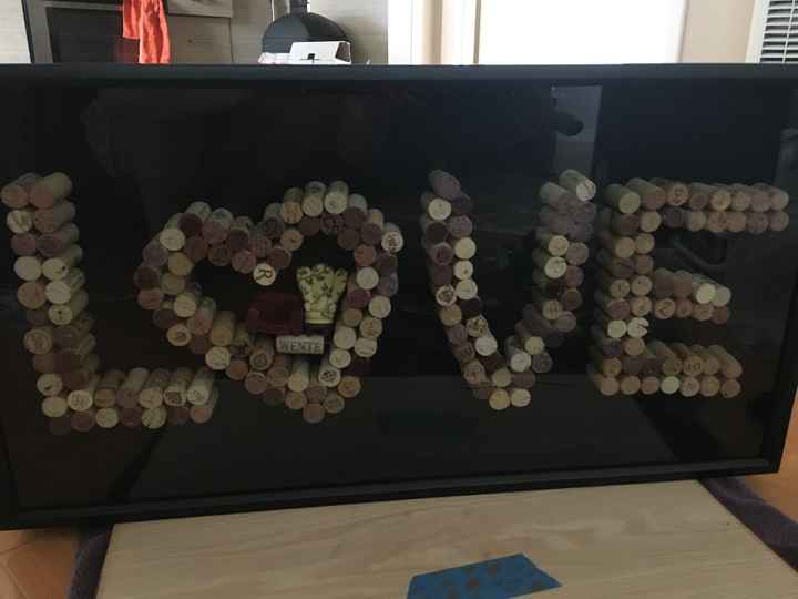Wine corks in shadowbox with our cake toppers