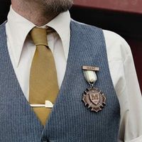 Bridesmaids have clutches, I have a brooch bouquet, I'm not using flowers anywhere so....