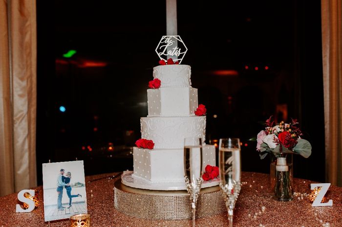 Our wedding cake with topper and flowers
