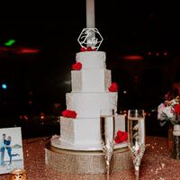Our wedding cake with topper and flowers