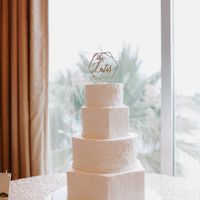 Our cake with the topper and no flowers on yet