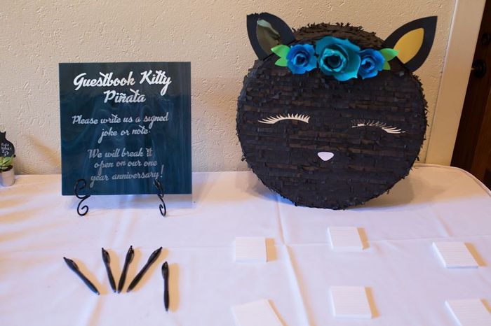 Kitty guest book piñata- however, I guess somehow kitty's ear got ripped during setup, :/ oh well!