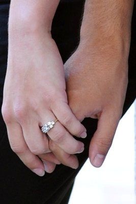 23 small diamonds, and one bigger diamond... I LOVE IT. Lets see some rings my fellow brides.